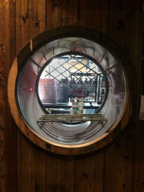 Neko inside circular window