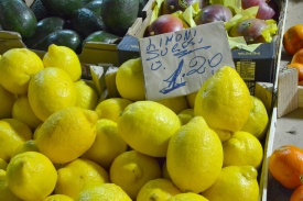Big bright lemons at an italian market